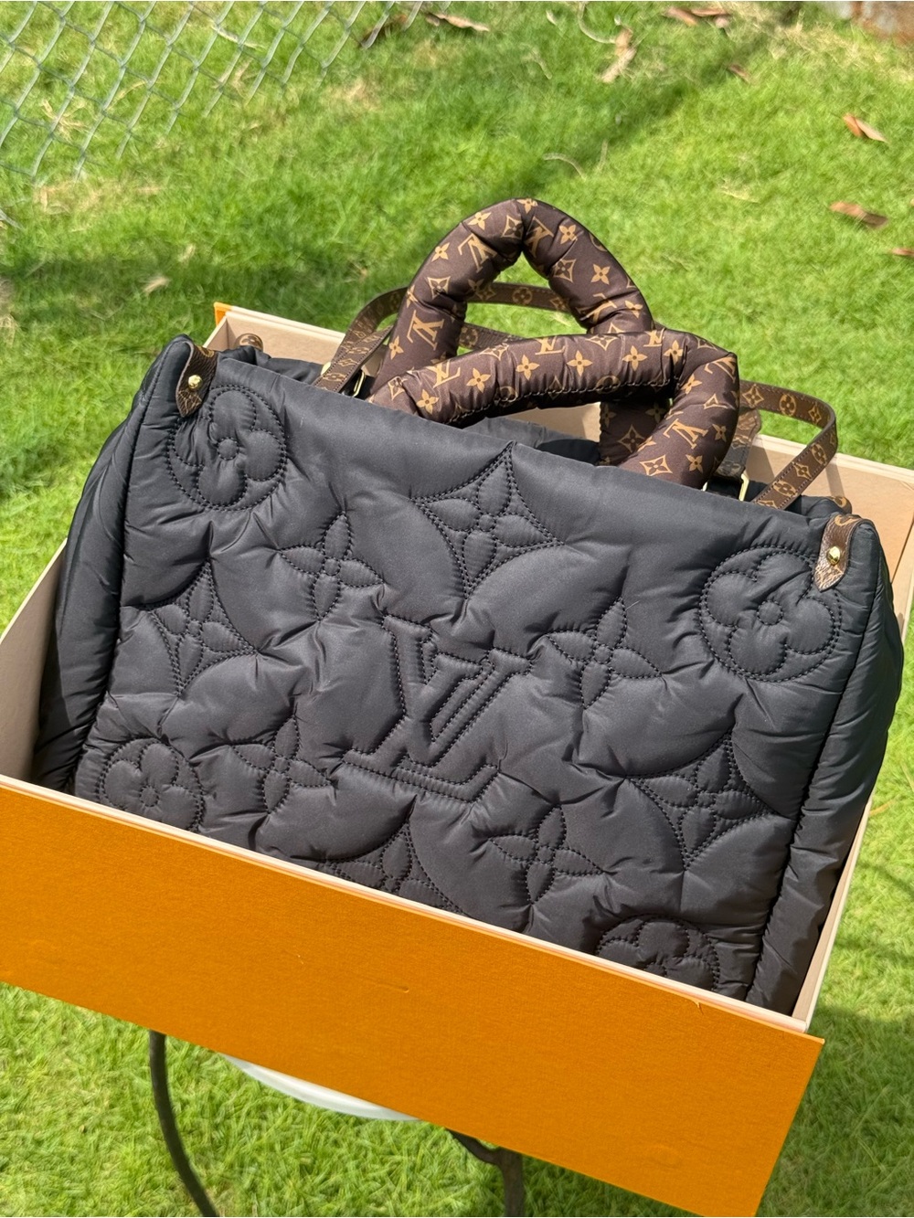 Louis Vuitton Pillow OnTheGo tote bag in black nylon.